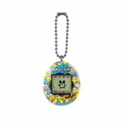 Tamagotchi-virtuaalilemmikkilelu, joka on koristeltu sarjakuvatyylisellä kuviolla